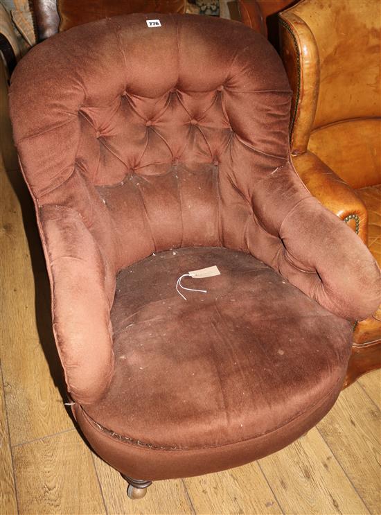 A Victorian button back armchair